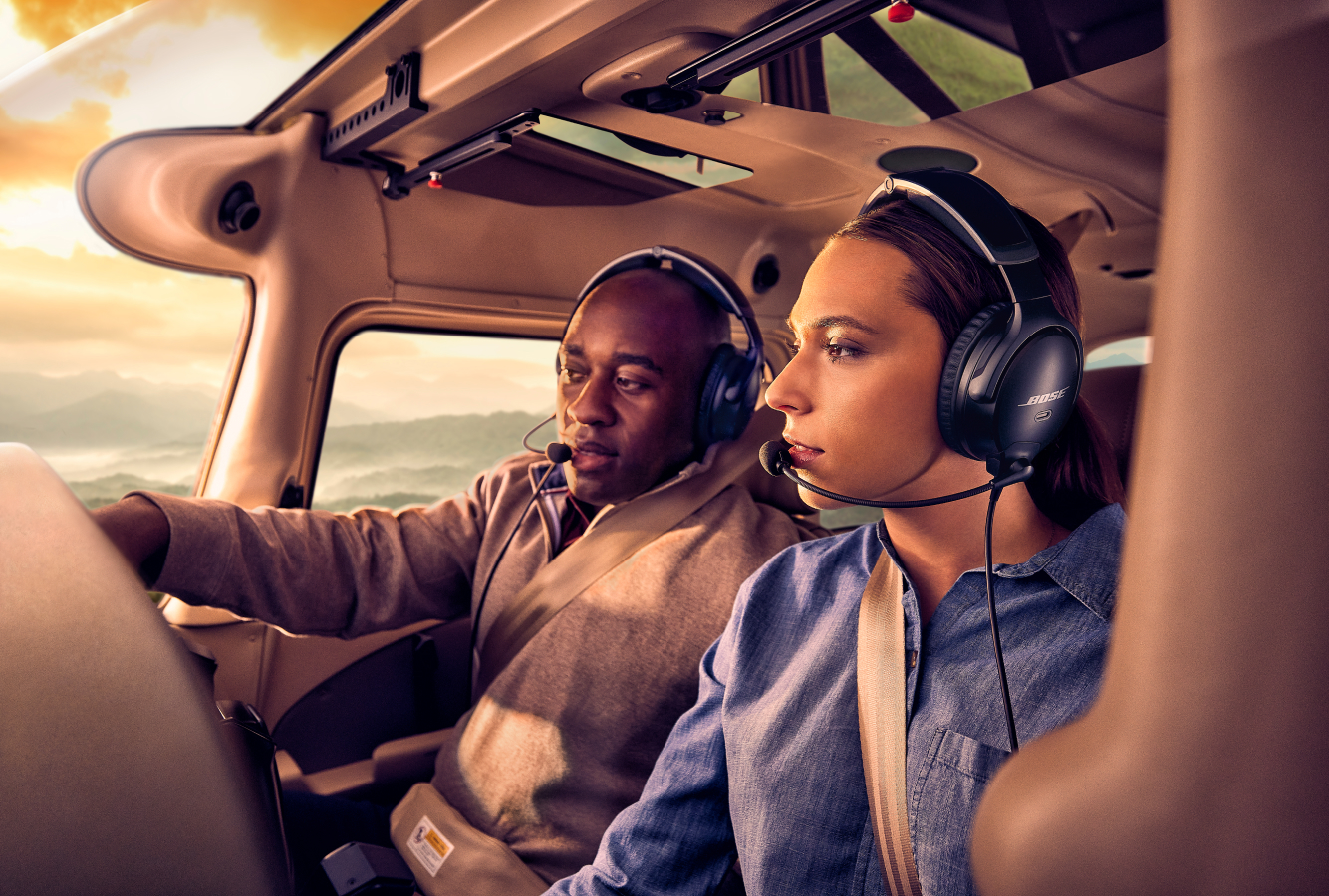 Two pilots flying airplane with Bose Aviation A30 Headsets