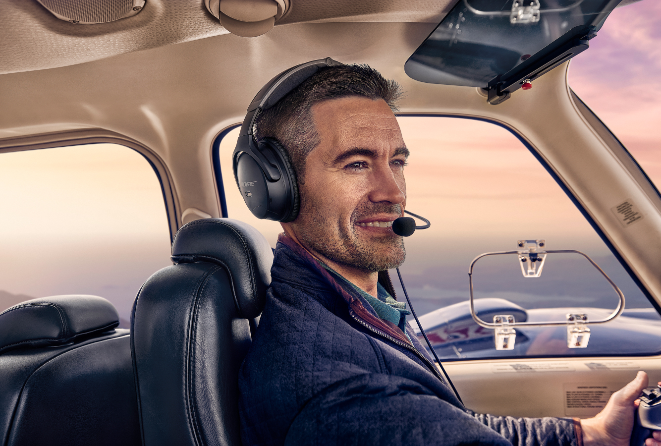 Pilot flying Baron plane wearing Bose Aviation a30 Headset