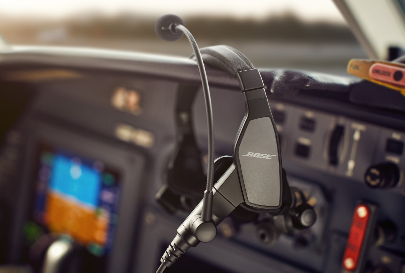 Bose Aviation ProFlight Headset resting on cockpit dashboard